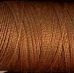 a spool of caramel Gütermann Maraflex stretch thread