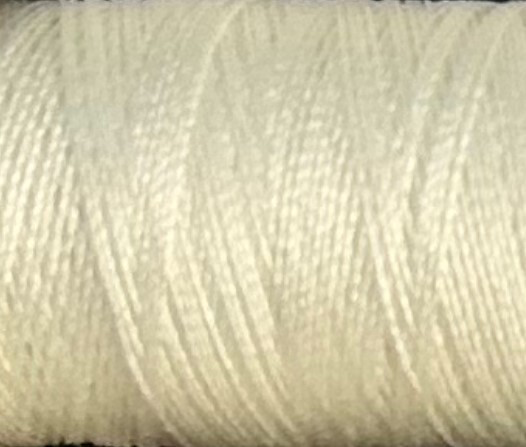 a spool of creamy white Gütermann Maraflex stretch thread