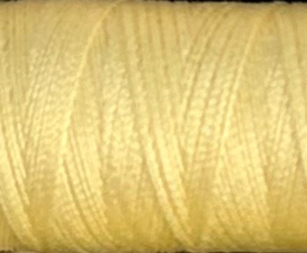 a spool of pale yellow Gütermann Maraflex stretch thread