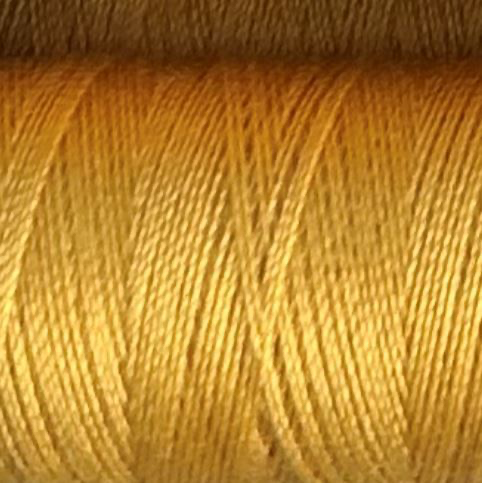 a spool of honey colored Gütermann Maraflex stretch thread