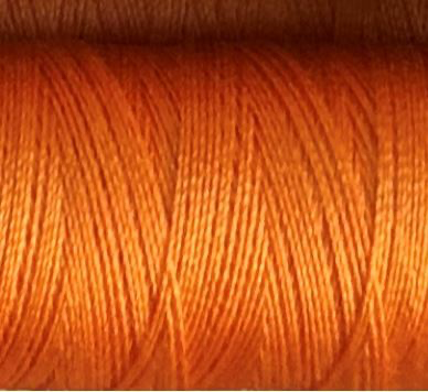 a spool of tangerine colored Gütermann Maraflex stretch thread