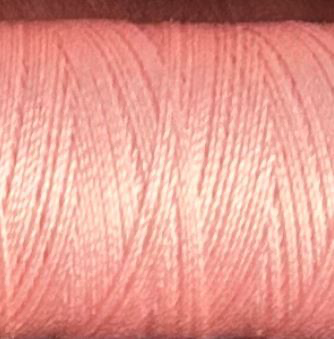a spool of light pink Gütermann Maraflex stretch thread