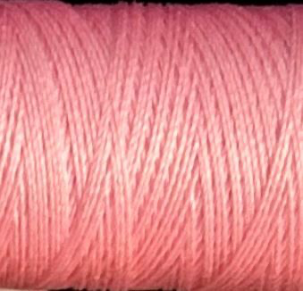 a spool of soft blush pink Gütermann Maraflex stretch thread