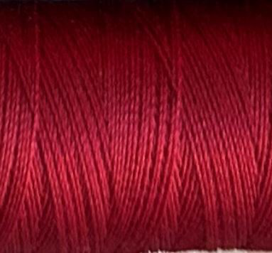 a spool of garnet red Gütermann Maraflex stretch thread