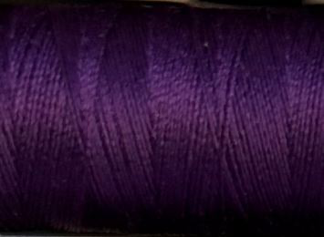a spool of rich purple Gütermann Maraflex stretch thread