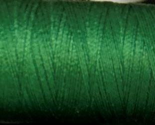a spool of emerald green Gütermann Maraflex stretch thread