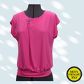 Pink blouse on a mannequin with a light gray background
