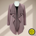 A sewing digital pattern for a flowy long sleeve open faced  jacket on a mannequin made of black and dusty pink fabric