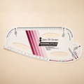 A Sure-Fit Designs Designing Stylus hip curve and back curve measurer, shown on a warm beige background. The clear plastic tool features printed measurement guides, black text, and a pink and purple striped brand graphic.