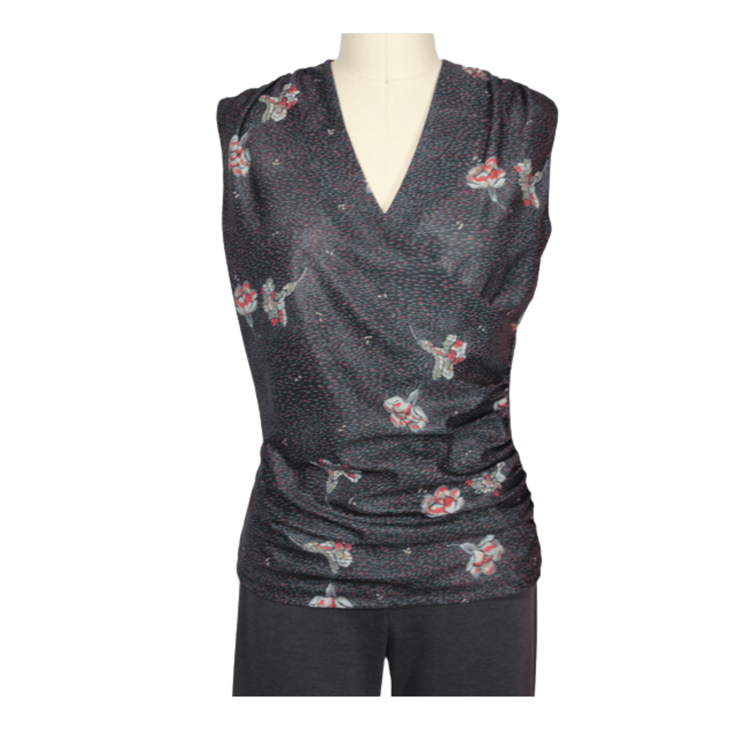 A digital sewing pattern for a cross over top.  The garment is a dark gray sleeveless top with floral patterns on a mannequin against a transparent background
