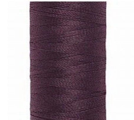 Spool of burgundy Gütermann Maraflex  thread on a white background