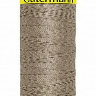 Spool of grey-tan Gütermann Maraflex thread on a white background