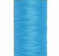 A bright light blue spool of Gütermann Maraflex thread on a white background