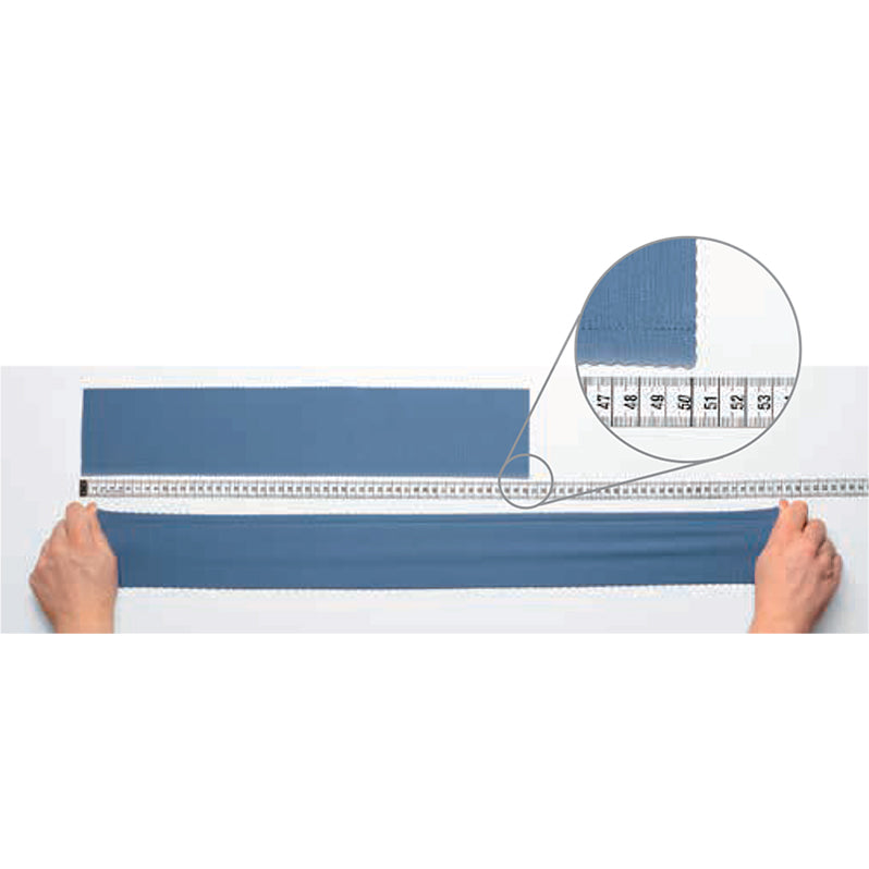 Person measuring a strip of blue fabric with a ruler on a white background